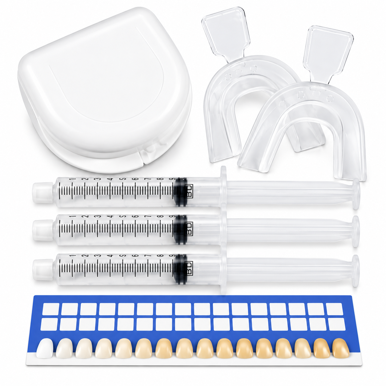 Teeth whitening kit with clear mouth trays, three gel syringes and a blue and white tooth shade guide