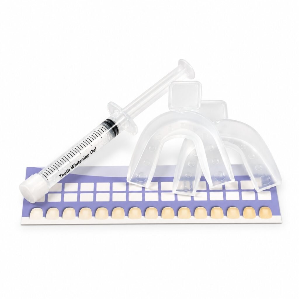 Clear whitening gel syringe beside transparent mouth trays and a purple and white teeth shade guide