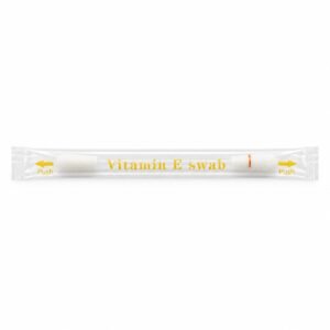 Sealed clear packet labelled Vitamin E swab with yellow push arrows at both ends