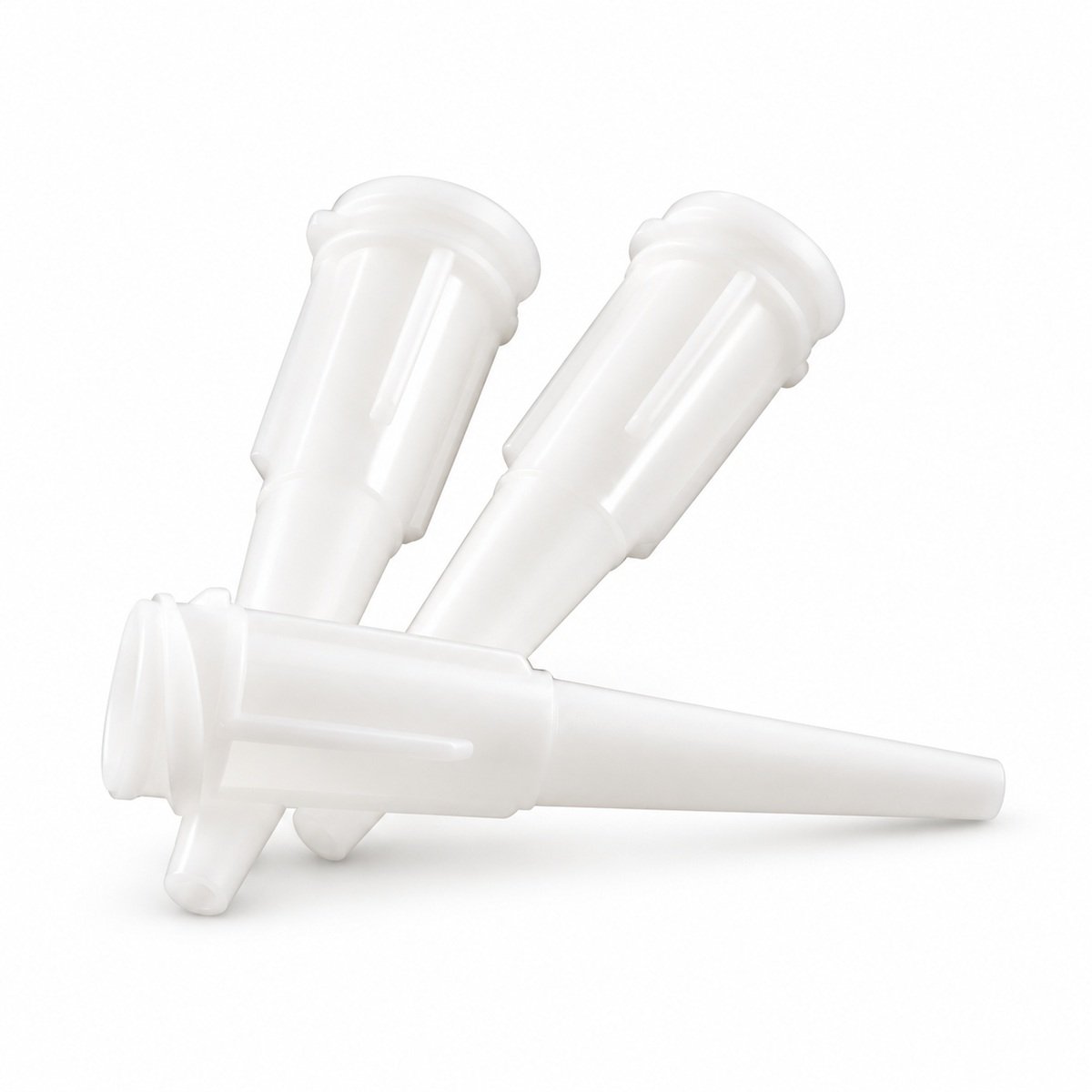 Three white plastic dental applicator tips on a white background