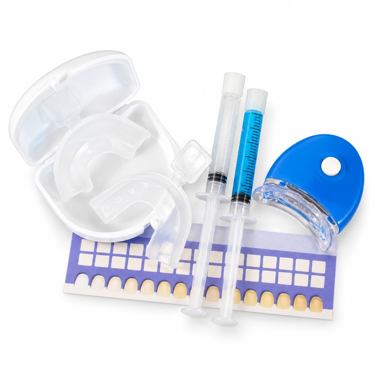 Teeth whitening kit with two mouth trays in a white case, two gel syringes, blue LED light and shade guide