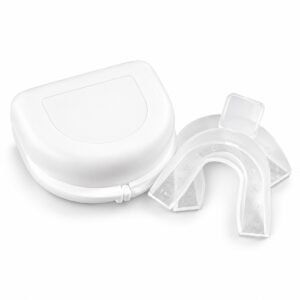 White ventilated retainer case beside two clear mouth trays on a white background